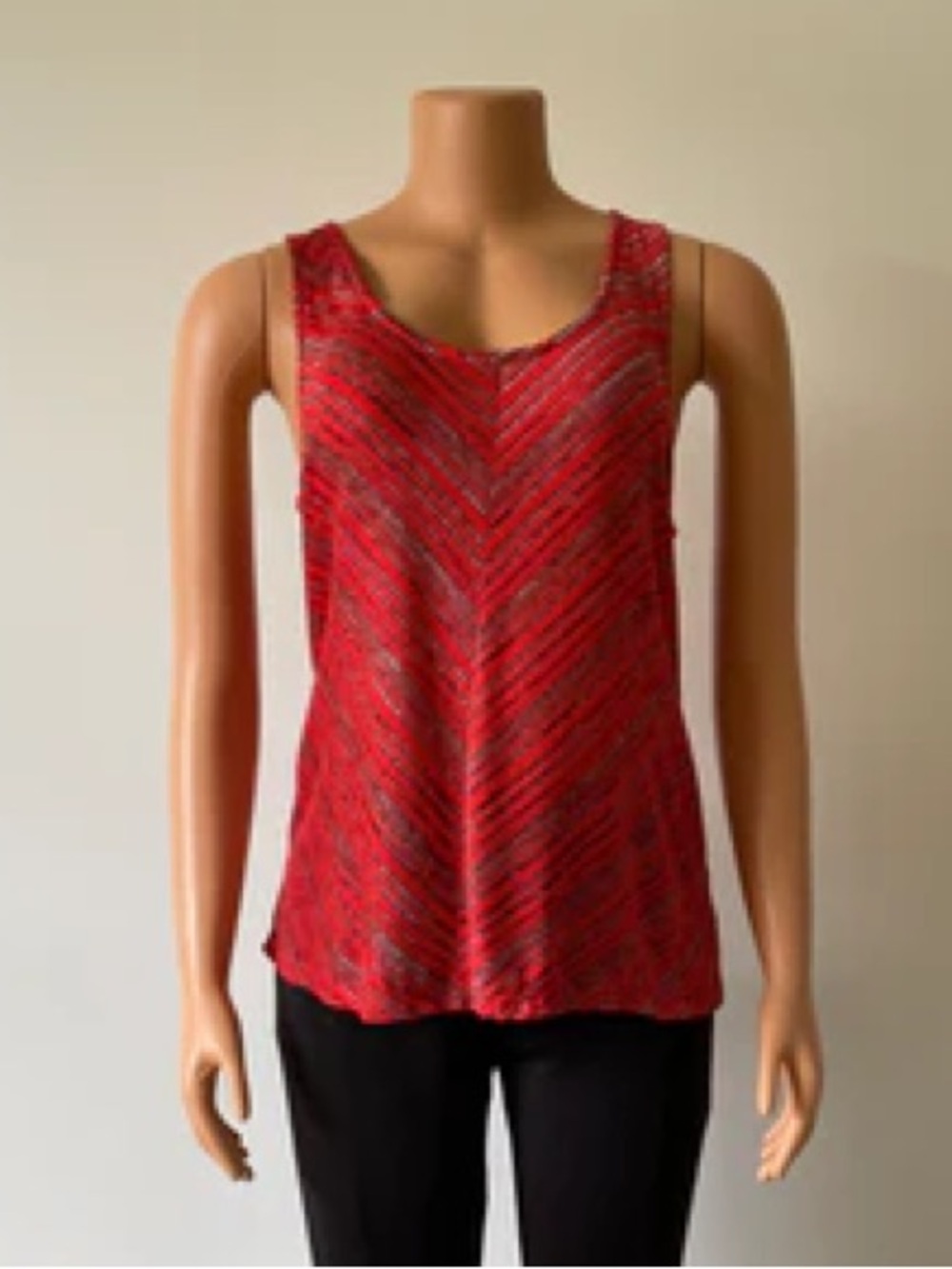 Stylish red striped sleeveless top features lace detailed back